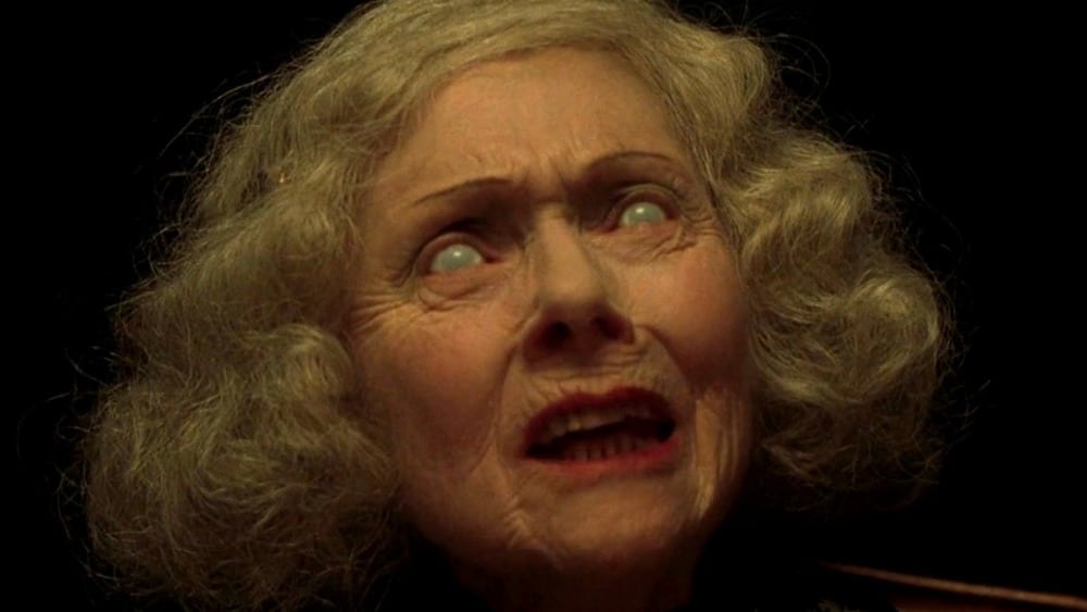 A weird woman's face with glassy eyes